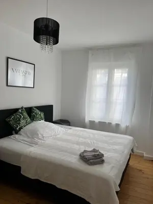 Ein Bett oder Betten in einem Zimmer der Unterkunft Stilvolle Altstadtwohnung mit 2 Schlafzimmern