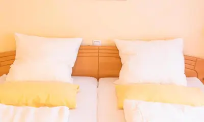 Ein Bett oder Betten in einem Zimmer der Unterkunft Ferienwohnung 4 Am Petersberg