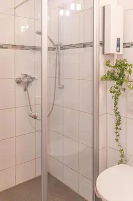 Ein Badezimmer in der Unterkunft Ferienwohnung 3 Am Petersberg