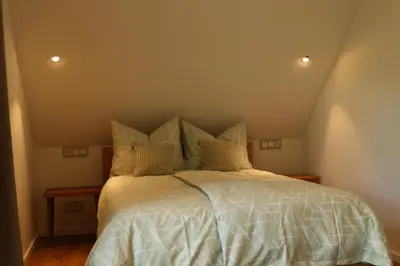 Ein Bett oder Betten in einem Zimmer der Unterkunft Ferienwohnungen und Gästezimmer Friedrichs