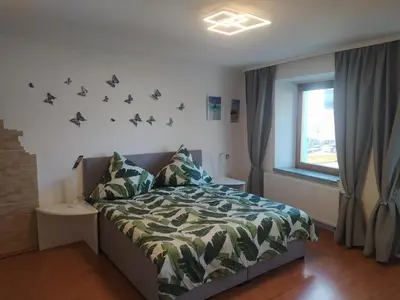 Ein Bett oder Betten in einem Zimmer der Unterkunft Ferienwohnung an der Ruwer, Trier