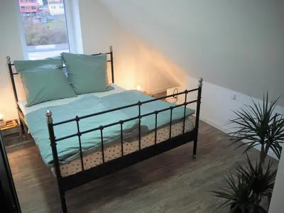 Ein Bett oder Betten in einem Zimmer der Unterkunft Kaffeevollautomat, Hängematte & Netflix, zentral