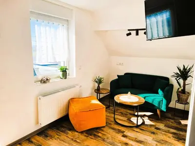 Ein Sitzbereich in der Unterkunft CJS Apartments - Chill or Drive am Nürburgring, new Box Spring Beds, new furniture, WLan, Spacious Rooms, Quiet Location