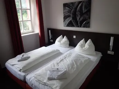 Ein Bett oder Betten in einem Zimmer der Unterkunft Altes Pfarrhaus