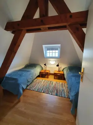 Ein Bett oder Betten in einem Zimmer der Unterkunft Am Burggraben auf der Sauerburg