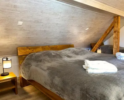 Ein Bett oder Betten in einem Zimmer der Unterkunft Gästehaus beim Metzger / Döttingen am Nürburgring
