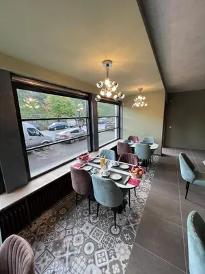 Ein Sitzbereich in der Unterkunft Pension Cafe Braun