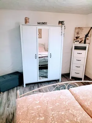 Ein Bett oder Betten in einem Zimmer der Unterkunft Ferienwohnung Schneider