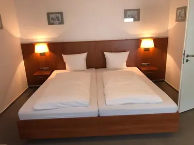 Ein Bett oder Betten in einem Zimmer der Unterkunft Hotel Garni Rabennest