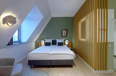 Ein Bett oder Betten in einem Zimmer der Unterkunft DEINHARD's