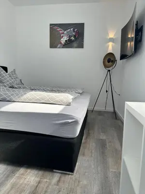 Ein Bett oder Betten in einem Zimmer der Unterkunft Deluxe Am Ring