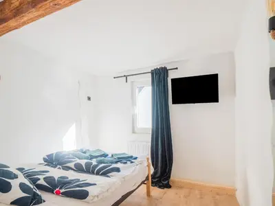 Ein Bett oder Betten in einem Zimmer der Unterkunft Cosy holiday home in Sankt Goarshausen with barbecue