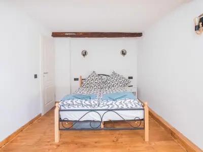 Ein Bett oder Betten in einem Zimmer der Unterkunft Exklusives Ferienhaus in Sankt Goarshausen am Rhein