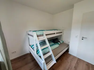 Ein Bett oder Betten in einem Zimmer der Unterkunft Ferienhaus Zum Prinzenkopf