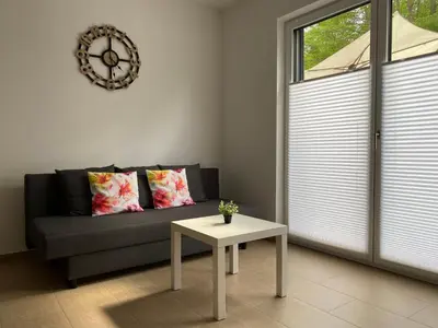 Ein Sitzbereich in der Unterkunft Ferienwohnung Im Dhrontal