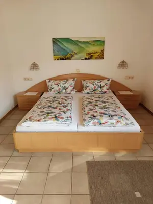 Ein Bett oder Betten in einem Zimmer der Unterkunft Wein- und Gästehaus Hermes-Hoffmann