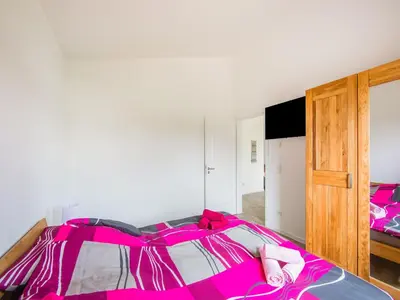 Ein Bett oder Betten in einem Zimmer der Unterkunft Ferienhaus Eifelruhe in Filz
