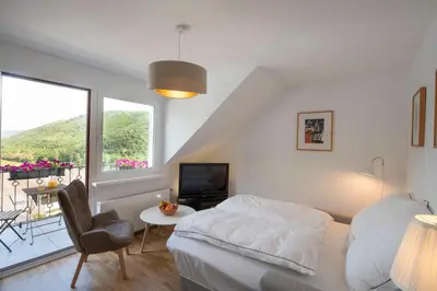Ein Bett oder Betten in einem Zimmer der Unterkunft Ferienwohnung Burgblick Coraidelstein
