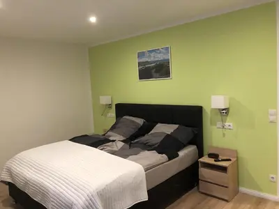 Ein Bett oder Betten in einem Zimmer der Unterkunft Ferienhaus Rheinblick