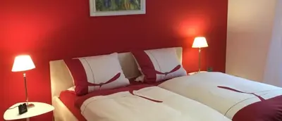 Ein Bett oder Betten in einem Zimmer der Unterkunft Komfort-Ferienwohnungen Walkmühle