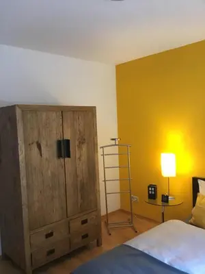 Ein Bett oder Betten in einem Zimmer der Unterkunft Komfort-Ferienwohnungen Walkmühle