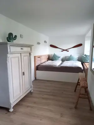 Ein Bett oder Betten in einem Zimmer der Unterkunft Leeseits Luv