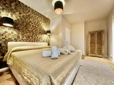 Ein Bett oder Betten in einem Zimmer der Unterkunft LuxApart Eifel mit privater Sauna