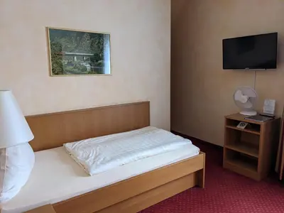Ein Bett oder Betten in einem Zimmer der Unterkunft Weinhaus Berg