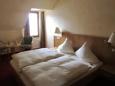 Ein Bett oder Betten in einem Zimmer der Unterkunft Weinhaus Berg