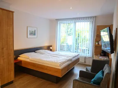 Ein Bett oder Betten in einem Zimmer der Unterkunft Ferienweingut Benedikt Nilles