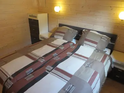 Ein Bett oder Betten in einem Zimmer der Unterkunft Eifel & See - Ferienhäuser am Waldsee Rieden/Eifel