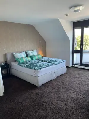 Ein Bett oder Betten in einem Zimmer der Unterkunft Luxusferienwohnung im Herzen der Altstadt von Koblenz