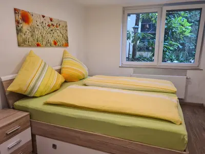 Ein Bett oder Betten in einem Zimmer der Unterkunft Ferienwohnung Zilliken