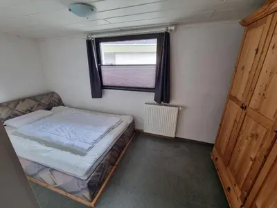 Ein Bett oder Betten in einem Zimmer der Unterkunft Ferienhaus Welling