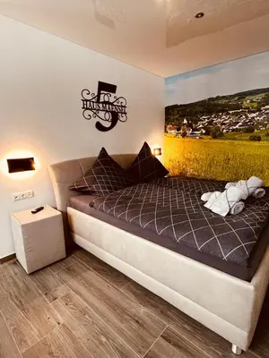 Ein Bett oder Betten in einem Zimmer der Unterkunft Haus Maensel