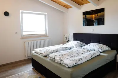 Ein Bett oder Betten in einem Zimmer der Unterkunft Ferienhaus Leonidas