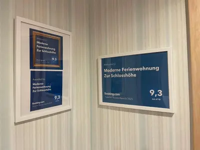 Ein Zertifikat, Auszeichnung, Logo oder anderes Dokument, das in der Unterkunft Moderne Ferienwohnung Zur Schlosshöhe ausgestellt ist