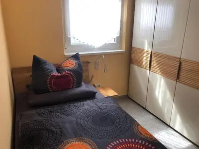 Ein Bett oder Betten in einem Zimmer der Unterkunft Ferienwohnung am Pferdemarkt