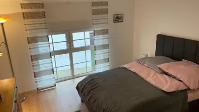 Ein Bett oder Betten in einem Zimmer der Unterkunft Ferienwohnung Brunnenblick