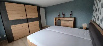 Ein Bett oder Betten in einem Zimmer der Unterkunft Ferienwohnung am Brohlbach
