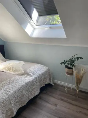 Ein Bett oder Betten in einem Zimmer der Unterkunft Neue Ferienwohnung im alten Forsthaus