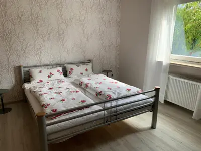 Ein Bett oder Betten in einem Zimmer der Unterkunft Grüne Oase