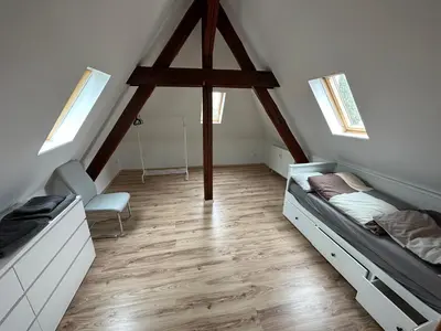 Ein Bett oder Betten in einem Zimmer der Unterkunft Schöne große Maisonettenwohnung in Weißenthurm