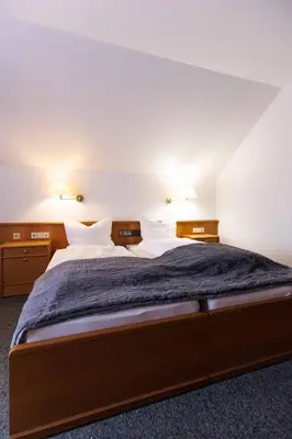 Ein Bett oder Betten in einem Zimmer der Unterkunft Naturhotel Blaubach