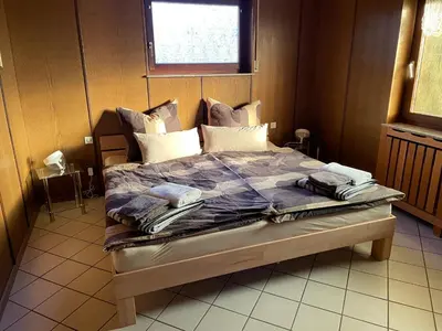 Ein Bett oder Betten in einem Zimmer der Unterkunft Ferienhaus Eifelblick