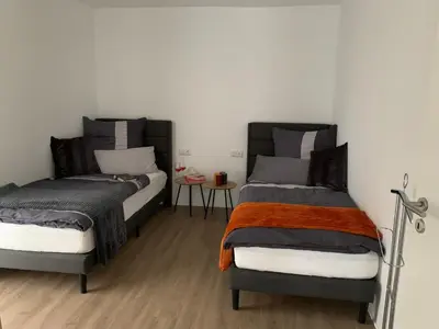 Ein Bett oder Betten in einem Zimmer der Unterkunft Eifel24, neues und barrierefreies Appartement mit Terrasse