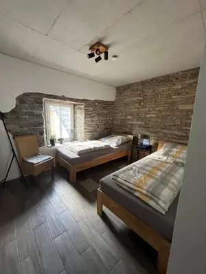 Ein Bett oder Betten in einem Zimmer der Unterkunft Ferienwohnung am Wald-und Wiesenkorb