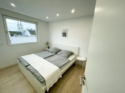 Ein Bett oder Betten in einem Zimmer der Unterkunft Ferienwohnung Schönes Maifeld