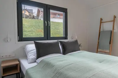 Ein Bett oder Betten in einem Zimmer der Unterkunft Velo & Wohnen -NEU- Elektroräder inklusive-Sauna-Moselblick