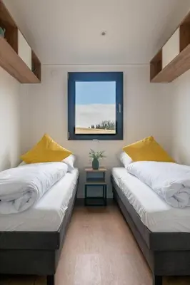 Ein Bett oder Betten in einem Zimmer der Unterkunft Velo & Wohnen -NEU- Elektroräder inklusive-Sauna-Moselblick